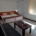 Monthly Apartment Rentals: Studio with sofa and balcony 